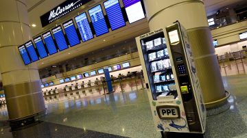 LAS VEGAS, NEVADA - MAY 14:  A personal protective equipment vending machine is set up in the Terminal 1 ticketing area at McCarran International Airport on May 14, 2020 in Las Vegas, Nevada. The airport used its social media platforms on Thursday to report that it was the first to install the machines that sell items such as masks, gloves and hand sanitizer. The nation's 10th busiest airport recorded a 53% decrease in arriving and departing passengers for March compared to the same month in 2019, a drop of more than 2.3 million travelers, as the COVID-19 pandemic impacts the travel industry.  (Photo by Ethan Miller/Getty Images)