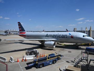 An American Airlines airplane is seen at gate at Washington National Airport (DCA) on April 11, 2020 in Arlington, Virginia. - Many flights are canceled due to the spread of the Coronavirus over the US. (Photo by Daniel SLIM / AFP) (Photo by DANIEL SLIM/AFP via Getty Images)