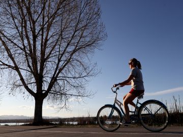 DENVER, COLORADO - APRIL 08: Cyclists take advantage of the pathway around the lake at Sloan's Lake Park on April 08, 2020 in Denver, Colorado. Sloan's Lake Park is home to the biggest lake in Denver and is the city’s second largest park. While many of the amenities are closed due to the COVID-19 crisis, the park remains open. (Photo by Matthew Stockman/Getty Images)