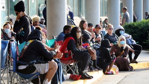 FRANKFORT, KY - JUNE 19: Hundreds of unemployed Kentucky residents wait in long lines outside the Kentucky Career Center for help with their unemployment claims on June 19, 2020 in Frankfort, Kentucky. (Photo by John Sommers II/Getty Images)