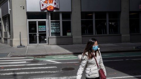 NEW YORK, NY - MARCH, 16: A pedestrian walks past a Crunch gym in Manhattan on March 16, 2020 in New York City. In another measure to try and contain the spread of the Coronavirus all gyms were ordered to close in New York City as of 8pm Monday. (Photo by Victor J. Blue/Getty Images)