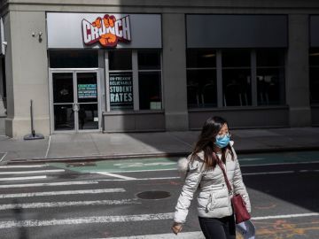 NEW YORK, NY - MARCH, 16: A pedestrian walks past a Crunch gym in Manhattan on March 16, 2020 in New York City. In another measure to try and contain the spread of the Coronavirus all gyms were ordered to close in New York City as of 8pm Monday. (Photo by Victor J. Blue/Getty Images)