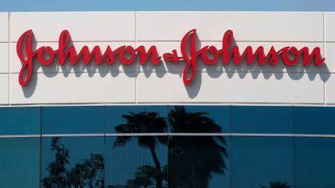 A sign on a building at the Johnson & Johnson campus shows their logo in Irvine, California on August 28, 2019. - The US pharmaceutical industry faces tens of billions of dollars in potential damage payments for fueling the opioid addiction crisis after Oklahoma won a $572 million judgment against drugmaker Johnson & Johnson. (Photo by Mark RALSTON / AFP) (Photo credit should read MARK RALSTON/AFP via Getty Images)
