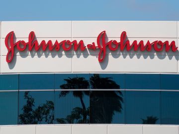 A sign on a building at the Johnson & Johnson campus shows their logo in Irvine, California on August 28, 2019. - The US pharmaceutical industry faces tens of billions of dollars in potential damage payments for fueling the opioid addiction crisis after Oklahoma won a $572 million judgment against drugmaker Johnson & Johnson. (Photo by Mark RALSTON / AFP)        (Photo credit should read MARK RALSTON/AFP via Getty Images)