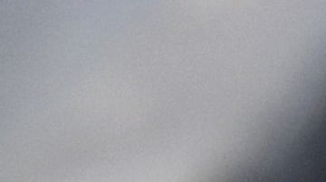 An employee checks the temperature of a visitor at the entrance of the annual book fair on the Red Square in downtown Moscow on June 6, 2020. - The open-air book fair is the first public event since the country eased lockdown measures taken to curb the spread of the COVID-19 pandemic, caused by the novel coronavirus. (Photo by Kirill KUDRYAVTSEV / AFP) (Photo by KIRILL KUDRYAVTSEV/AFP via Getty Images)