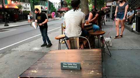 View of the tables set by a restaurant on its terrace in the Hell's Kitchen neighborhood, in New York, USA, 13 June 2020 (issued 14 June 2020). New York City is discovering terraces for eating and drinking "al fresco" at the start of its reopening after the break by COVID-19, three months that have plunged the businesses of the commercial and tourist heart of Manhattan and other districts in a crisis from which many still see no way out, mired in pessimism and uncertainty. EFE/Nora Quintanilla