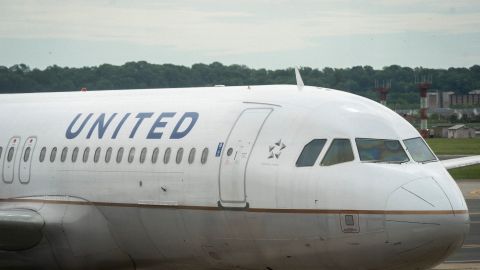 ARLINGTON, VA - MAY 05: A United Airlines plane sits at a gate Ronald Reagan Washington National Airport, May 5, 2020 in Arlington, Virginia. According to leaked internal memos, United Airlines plans to cut at least 3,400 management and administrative positions in October and potentially lay off up to 30 percent of their pilots. (Photo by Drew Angerer/Getty Images)