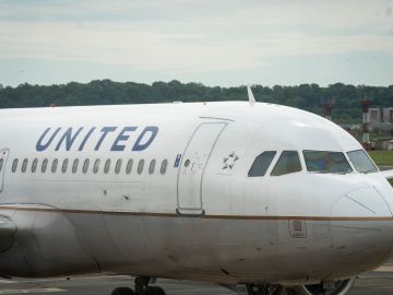 ARLINGTON, VA - MAY 05: A United Airlines plane sits at a gate Ronald Reagan Washington National Airport, May 5, 2020 in Arlington, Virginia. According to leaked internal memos, United Airlines plans to cut at least 3,400 management and administrative positions in October and potentially lay off up to 30 percent of their pilots. (Photo by Drew Angerer/Getty Images)