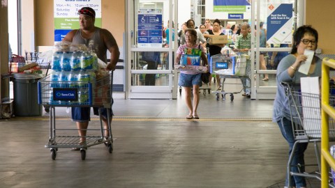 HONOLULU, HI - AUGUST 22:   Crowds of shoppers with shopping carts full of supplies for Hurricane Lane exit Sams Club on Wednesday, August 22, 2018 in Honolulu, Hi. Lane is a high-end Category 4 hurricane and remains a threat to the entire island chain. (Photo by Kat Wade/Getty Images)