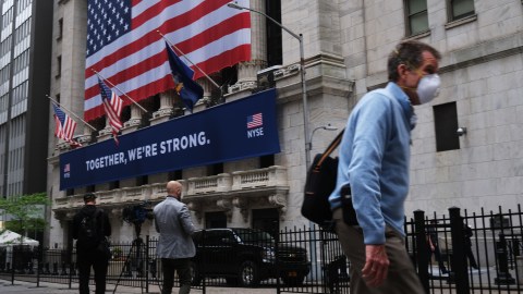 NEW YORK, NEW YORK - MAY 26: The New York Stock Exchange (NYSE) stands in lower Manhattan on the first day that traders are allowed back onto the historic floor of the exchange on May 26, 2020 in New York City. While only a small number of traders will be returning at this time, those that do will have to take temperature checks and wear face masks at all times while on the floor. The Dow rose over 600 points in morning trading as investors see economic activity in America picking up (Photo by Spencer Platt/Getty Images)