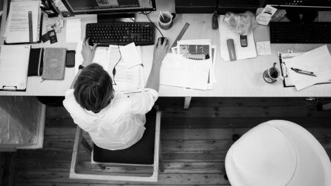 black-and-gray-photo-of-person-in-front-of-computer-monitor-140945