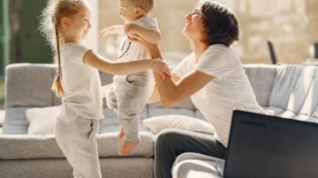 happy-mother-playing-with-kids-at-home-4017416