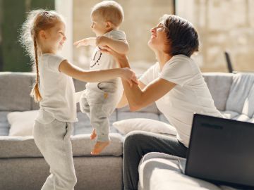happy-mother-playing-with-kids-at-home-4017416