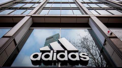 The logo of German sporting goods company Adidas is pictured at one of the company's outlets in Berlin on March 29, 2020. - Major retailers in Germany say they plan to stop paying rent for stores that were told to close in order to slow the pandemic. Adidas is leading the charge, along with shoe chain Deichmann and Swedish clothing giant H&M. (Photo by Odd ANDERSEN / AFP) (Photo by ODD ANDERSEN/AFP via Getty Images)