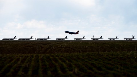 DENVER, CO - APRIL 22: A Southwest Airlines flight takes off as United Airlines planes sit parked on a runway at Denver International Airport as the coronavirus pandemic slows air travel on April 22, 2020 in Denver, Colorado. Compared to the same time last year, Denver International Airport is operating 1,000 fewer flights daily. (Photo by Michael Ciaglo/Getty Images)