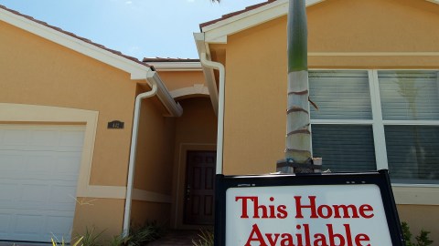 MIAMI - JUNE 23: A sign indicating a new home is available for sale is seen on June 23, 2010 in Miami, Florida. The Commerce Department today announced new home sales declined 32.7% to a seasonally adjusted annual rate of 300,000 in May. (Photo by Joe Raedle/Getty Images)