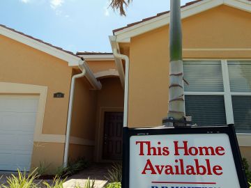 MIAMI - JUNE 23: A sign indicating a new home is available for sale is seen on June 23, 2010 in Miami, Florida. The Commerce Department today announced new home sales declined 32.7% to a seasonally adjusted annual rate of 300,000 in May. (Photo by Joe Raedle/Getty Images)