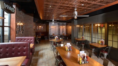 NEW YORK, NY - AUGUST 19: Denny's opens first New York City location, featuring a first-of-its-kind design, exclusive architecture and full-service craft cocktail bar unique to Lower Manhattan. Located at 150 Nassau Street, the look and feel of the new Denny's draws inspiration from the charm, character and flair of legendary downtown New York eateries, combining locally-inspired, historical elements with a classic, American diner atmosphere on August 19, 2014 in New York City.  (Photo by Eugene Gologursky/Getty Images for Denny's)