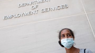 Diana Yitbarek, 44, of Washington, DC, stands outside the DC Department of Employment Services, after trying to find out about her unemployment benefits in Washington, DC, July 16, 2020. - Americans worry as unemployment benefits are due to end soon. (Photo by SAUL LOEB / AFP) (Photo by SAUL LOEB/AFP via Getty Images)