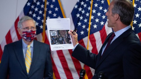 WASHINGTON, DC - JUNE 30: U.S. Sen. John Thune (R-SD) holds up a Los Angeles Times article during a press conference following the weekly Senate Republican policy luncheon in the Hart Senate Office Building on June 30, 2020 in Washington, DC. McConnell stated that a briefing could be arranged for Senators to get more information on the report that Russia offered bounty to the Taliban to kill American soldiers. (Photo by Stefani Reynolds/Getty Images)