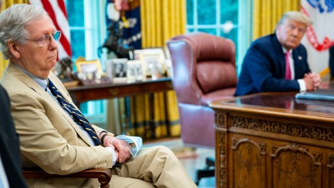 WASHINGTON, DC - JULY 20: Senate Majority Leader Mitch McConnell (R-KY) (L) listens to U.S. President Donald Trump talks to reporters while hosting Republican congressional leaders and members of Trump's cabinet in the Oval Office at the White House July 20, 2020 in Washington, DC. Trump and the congressional leaders talked about a proposed new round of financial stimulus to help the economy during the ongoing global coronavirus pandemic. (Photo by Doug Mills-Pool/Getty Images)