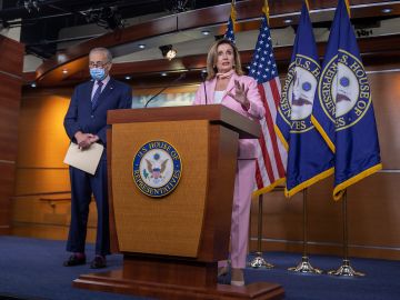 WASHINGTON, DC - JULY 23: Speaker of the House Nancy Pelosi (D-CA) speaks as Senate Minority Leader Chuck Schumer (D-NY)  listen during a press briefing on July 23, 2020 in Washington, DC. The $600 weekly federal unemployment benefit that was passed as part of the CARES Act is set to expire on July 31st.  (Photo by Tasos Katopodis/Getty Images)