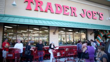 PINECREST, FL - OCTOBER 18: Shoppers lineup as they wait for the grand opening of a Trader Joe's on October 18, 2013 in Pinecrest, Florida. Trader Joe's opened its first store in South Florida where shoppers can now take advantage of the California grocery chains low-cost wines and unique items not found in other stores. About 80 percent of what they sell is under the Trader Joe's private label. (Photo by Joe Raedle/Getty Images)