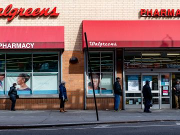 NEW YORK, NY - APRIL 14: People stand in line outside of Walgreens on Westchester Avenue on April 14, 2020 in the Bronx borough of New York City. New York Governor Andrew Cuomo said on Monday that "the worst is over," as he announced New York is joining six other states in planning how and when to safely reopen schools, businesses and workplaces. New York reportedly has over 200,000 confirmed cases of COVID-19 and 10,000 deaths. (Photo by David Dee Delgado/Getty Images)