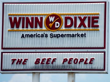 JACKSONVILLE, FL - JUNE 22: A sign for the Winn Dixie Supermarket corporate office stands June 22, 2005 in Jacksonville, Florida. The bankrupt supermarket chain announced June 21 it will cease operations in four southern states and cut 22,000 jobs. The company will stop operating in Tennessee, Virginia and the Carolinas.  (Photo by Stephen Morton/Getty Images)