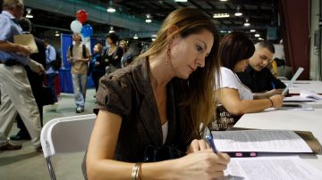 PHOENIX, AZ  - MARCH 31: Laura Anne Fransen fills out an application during the Arizona Workforce Connection Career Expo at the Arizona State Fair Grounds on March 31, 2010 in Phoenix, Arizona. 23,000 jobs were lost in the private sector this March and US Treasury Secretary Timothy Geithner has recently warned jobless Americans that within the year the unemployment situation will remain high. It's estimated that more than 100,000 jobs need to be created each month to push the jobless rate down from its current level.  (Photo by Joshua Lott/Getty Images)