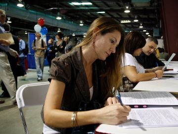 PHOENIX, AZ  - MARCH 31: Laura Anne Fransen fills out an application during the Arizona Workforce Connection Career Expo at the Arizona State Fair Grounds on March 31, 2010 in Phoenix, Arizona. 23,000 jobs were lost in the private sector this March and US Treasury Secretary Timothy Geithner has recently warned jobless Americans that within the year the unemployment situation will remain high. It's estimated that more than 100,000 jobs need to be created each month to push the jobless rate down from its current level.  (Photo by Joshua Lott/Getty Images)