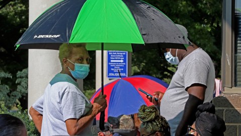 FRANKFORT, KY - JUNE 19: Hundreds of unemployed Kentucky residents wait in long lines outside the Kentucky Career Center for help with their unemployment claims on June 19, 2020 in Frankfort, Kentucky. (Photo by John Sommers II/Getty Images)