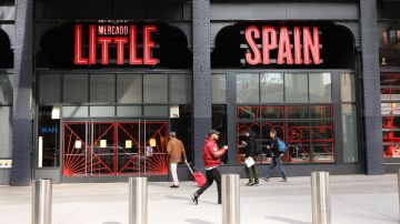 NEW YORK, NEW YORK - MARCH 27: People walk by Mercado Little Spain in the newly opened Hudson Yards development on March 27, 2019 in New York City. The 35,000-square-foot food hall, which had a soft opening on March 15, was created by famed chef José Andrés. Mercado Little Spain features three full-service restaurants; wine, tapas, and cocktail bars; a coffee shop; and nearly a dozen food stalls. (Photo by Spencer Platt/Getty Images)