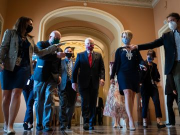WASHINGTON, DC - JULY 30: Senate Majority Leader Mitch McConnell (R-KY) is swarmed by reporters as he leaves the Senate floor and walks to his office at the U.S. Capitol on July 30, 2020 in Washington, DC. Republicans and Democrats in the Senate remain in a stalemate as the the $600-per-week federal unemployment benefit in place due to the coronavirus pandemic is set to expire on Friday. (Photo by Drew Angerer/Getty Images)