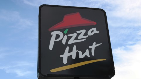 MIAMI, FLORIDA - AUGUST 17: A sign is seen at a Pizza Hut restaurant on August 17, 2020 in Miami, Florida. NPC International announced it had reached an agreement with Yum! Brands, the parent company of Pizza Hut, to close approximately 300 Pizza Hut locations after it filed for bankruptcy. (Photo by Joe Raedle/Getty Images)