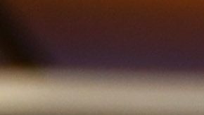 Airport employee Gigi Bebikianat checks temperatures for international travelers before allowing them to go to their gates, at Los Angeles International airport on August 12, 2020 in Los Angeles during the coronavirus pandemic. - On August 11, 559,420 passengers passed through T.S.A. security checks, compared with just over 2.3 million passengers on the same day one year ago. At the same time the August 11, 2020 number is a large jump up from April 12, 2020 when only 90,510 passengers traveled out of US airports, according to U.S. Transportation Security Administration (TSA) records. (Photo by Robyn Beck / AFP) (Photo by ROBYN BECK/AFP via Getty Images)