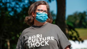 Sarah Lloyd, a member of the Farmers Union and vice president of the local chapter, wears a facemask as she poses on her farm in Wisconsin Dells, Wisconsin, on August 16, 2020. - Lloyd's family farm is nestled in a hollow in the green hills just outside of Juneau County in the midwestern US state. Four years ago, the county saw a major political turnaround -- after twice voting for Barack Obama, it backed Donald Trump over Hillary Clinton. The county, which is located about an hour's drive north of the state capital Madison, could act as a bellwether for the November 3 election, in which Trump will battle Democrat Joe Biden. (Photo by KAMIL KRZACZYNSKI / AFP) (Photo by KAMIL KRZACZYNSKI/AFP via Getty Images)