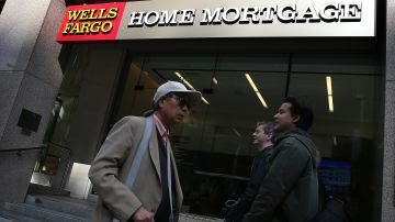 SAN FRANCISCO, CA - OCTOBER 11:  Pedestrians walk by a Wells Fargo home mortgage office on October 11, 2013 in San Francisco, California. Wells Fargo reported a 13 percent increase in third-quarter profits with a net income of $5.6 billion, or 99 cents a share compared to $4.9 billion, or 88 cents a share one year ago.  (Photo by Justin Sullivan/Getty Images)