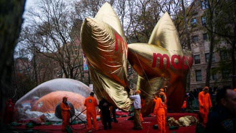 NEW YORK, NY - NOVEMBER 27: Parade volunteers work on Macys balloons during the inflation process on November 27, 2019 in New York City. Winds could ground the giant balloons, according to city regulations, giant balloons cannot fly with gusts winds above 34 m.p.h. (Photo by Eduardo Munoz Alvarez/Getty Images)