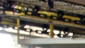 FLINT, MI - JANUARY 24:  Two women work on the engine of a GM truck on the assembly line of the General Motors Flint Assembly Plant January 24, 2011 in Flint, Michigan. In response to customer demand GM announced they are adding a third shift and an estimated 750 jobs at the plant. (Photo by Bill Pugliano/Getty Images)