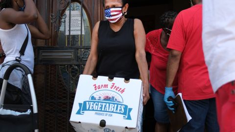 NEW YORK, NEW YORK - JULY 22: Food is distributed at the Ebenezer Seventh-day Adventist church on July 22, 2020 in the Brooklyn borough of New York City. The church distributes hundreds of packages of food every Wednesday. While many New York neighborhoods have long depended on charities, food banks and nonprofits to meet their nutritional needs, the Covid-19 pandemic has only multiplied the number of residents experiencing food insecurity. Across the city groups that serve those in need are seeing a huge increase in clients. According to the mayor’s office, an estimated 2 million people are currently food insecure in New York City, which is up from 1 million people before the pandemic. (Photo by Spencer Platt/Getty Images)
