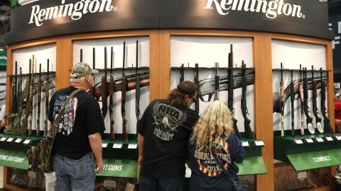 DALLAS, TX - MAY 05:  Attendees look at a display of Remington shotguns during the NRA Annual Meeting & Exhibits at the Kay Bailey Hutchison Convention Center on May 5, 2018 in Dallas, Texas.  The National Rifle Association's annual meeting and exhibit runs through Sunday.  (Photo by Justin Sullivan/Getty Images)