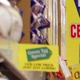CHICAGO - JANUARY 15:  CHICAGO - JANUARY 15: Shoppers peruse an aisle at the new Food 4 Less store January 15, 2003 in Chicago. Food 4 Less, the United States' leading price-impact supermarket chain, is a unique hybrid, warehouse-format supermarket store and opened today in a formerly vacant building that previously housed a Montgomery Wards department store. The new 59,000 square-foot store, a division of The Kroger Company, will employ more than 140 full and part-time staff members, mostly from the surrounding community. (Photo by Tim Boyle/Getty Images)