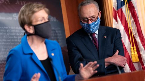 WASHINGTON, DC - OCTOBER 20: Senate Minority Leader Chuck Schumer (D-NY) (R) listens as U.S. Sen. Elizabeth Warren (D-MA) speaks during a news conference on Capitol Hill on October 20, 2020 in Washington, DC. Senate Republicans are looking to hold a confirmation vote for Supreme Court nominee Amy Coney Barrett on Monday, October 26, approximately one week before the Presidential election. (Photo by Stefani Reynolds/Getty Images)