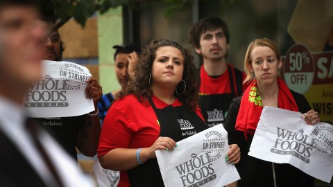 CHICAGO, IL - JULY 31: Whole Foods Market employees and union activists protest outside a Whole Foods Market store on July 31, 2013 in Chicago, Illinois. The protest was one of many scheduled against fast food and retail stores in several cities nationwide. The campaign, dubbed "Fight for 15", calls for workers to be paid at least $15-per-hour and have the right to form unions without retaliation. Similar protests are scheduled in New York City, St. Louis, Detroit, Milwaukee, Kansas City and Flint, Michigan. (Photo by Scott Olson/Getty Images)