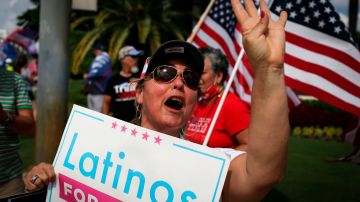 Supporters of US President Donald Trump rally outside the "Latinos for Trump Roundtable" event at Trump National Doral Miami golf resort in Doral, Florida, on September 25, 2020. (Photo by Marco BELLO / AFP) (Photo by MARCO BELLO/AFP via Getty Images)