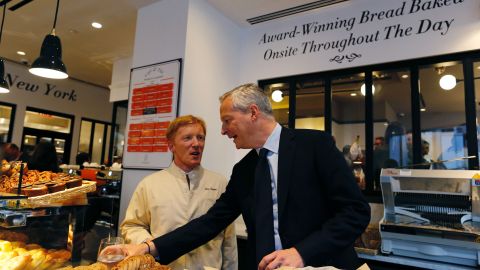 French Economy Minister Bruno Le Maire (R) speaks with Eric Kayser during a visit to the Maison Kayser bakery on June 28, 2017 in New York. / AFP PHOTO / EDUARDO MUNOZ ALVAREZ (Photo credit should read EDUARDO MUNOZ ALVAREZ/AFP via Getty Images)