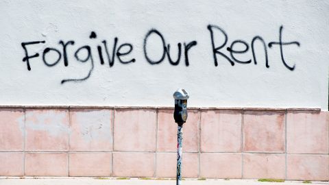 A graffiti asking for rent forgiveness is seen on a wall on La Brea Ave on National May Day amid the Covid-19 pandemic, May 1, 2020, in Los Angeles, California. - Several cities and states, including California, have passed executive orders prohibiting eviction of tenants affected by the coronavirus crisis.
But when the lockdown lifts, the moratorium will end. And tenants will have to pay their back-rent or move out. (Photo by VALERIE MACON / AFP) (Photo by VALERIE MACON/AFP via Getty Images)