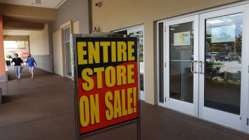 MIAMI, FLORIDA - AUGUST 12: A sign reading, ' Entire Store on Sale,' is seen at the entrance to a Stein Mart store on August 12, 2020 in Miami, Florida. Stein Mart announced that it has filed for Chapter 11 bankruptcy protection and plans to permanently close most, if not all, of its stores, partially blaming the change in shopping habits during the coronavirus pandemic for the bankruptcy. (Photo by Joe Raedle/Getty Images)