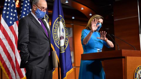 US Speaker of the House, Nancy Pelosi (R), Democrat of California, and Senate Minority Leader Chuck Schumer, Democrat of New York hold a press briefing on Capitol Hill in Washington, DC, on November 6, 2020. - Schumer warned his Republican colleagues Thursday that they were "poisoning" the country's democracy by continuing to refuse to acknowledge Joe Biden's presidential election victory last week. (Photo by Nicholas Kamm / AFP) (Photo by NICHOLAS KAMM/AFP via Getty Images)